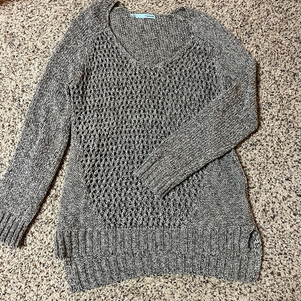 Lightweight sweater, knit, yet see-through.